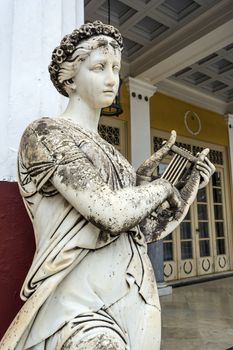 Achilleion palace, Corfu, Greece - August 24, 2018: Statue of a Greek mythical muse in the Achilleion palace in Corfu, Greece