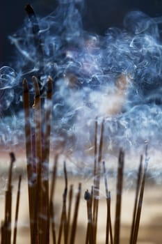 Burning incence sticks in a Buddhist temple