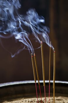 Burning incence sticks in a Buddhist temple