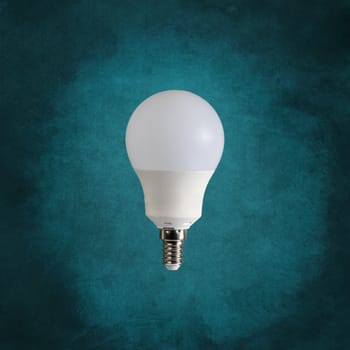 a light bulb isolated in front of an antique background