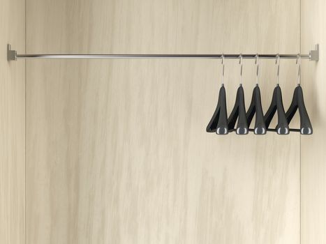 Row of empty hangers in the wardrobe