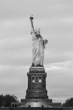 Statue of Liberty at dusk, New York City, USA. Black and white image.