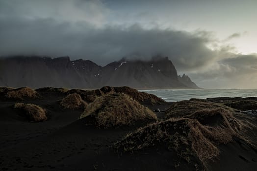 Vestrahorn mountain and dunes before the sunrise in a cloudy day, Iceland