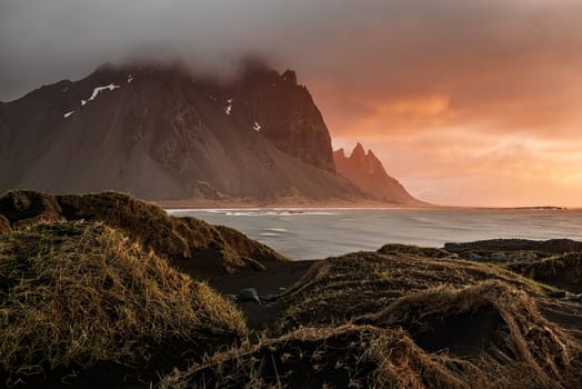 Vestrahorn mountain and dunes at sunrise in a cloudy day, Iceland
