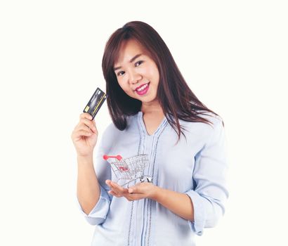 Women holding credit cards and shopping cart, shopping concept