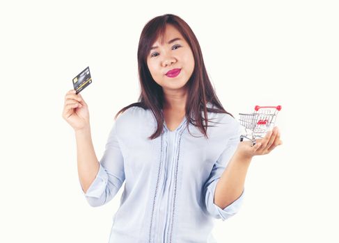 Women holding credit cards and shopping cart, shopping concept