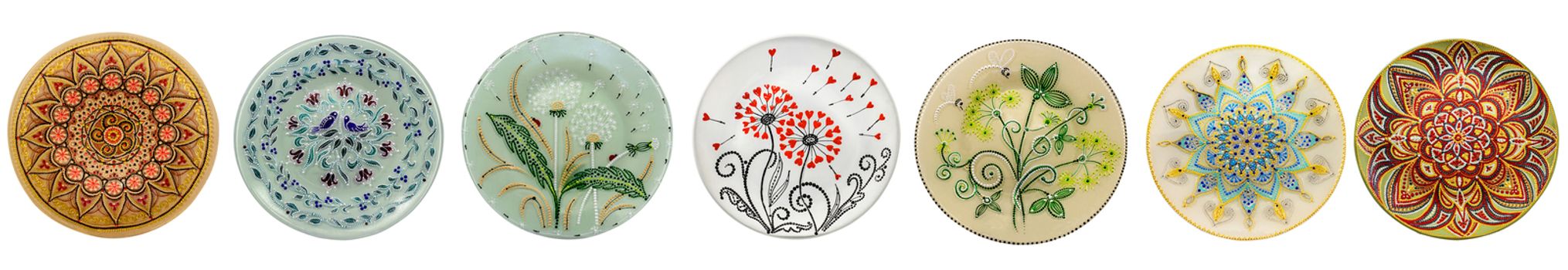 Set of decorative ceramic dishes hand-painted with acrylic paints floral pattern isolated on white background.