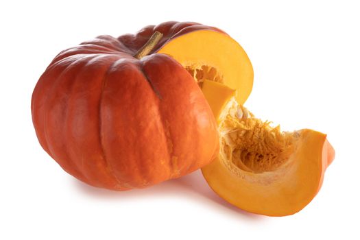 One cut orange pumpkin isolated on white background