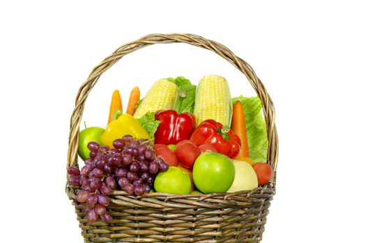 fresh vegetables and fruits in wicker basket over white background