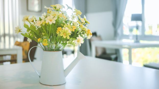 A bouquet of artificial flowers in pot