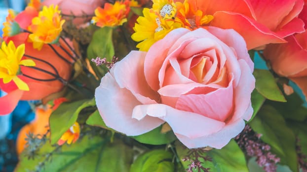 colorful of the plastic flowers bouquet , soft of focus