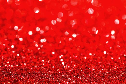 Abstract glitter bokeh holiday red background