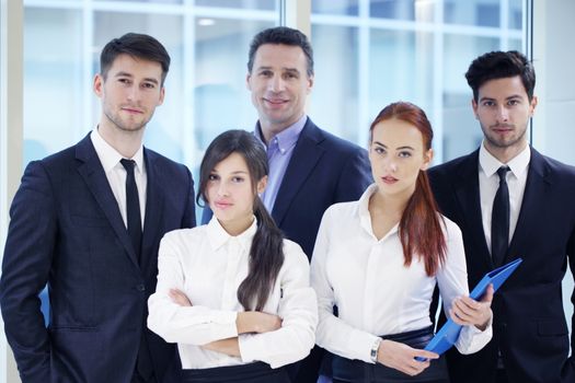 Portrait of business team of men and women indoors