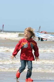 a blonde girl on stormy beach