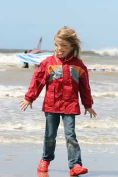 a blonde girl on stormy beach
