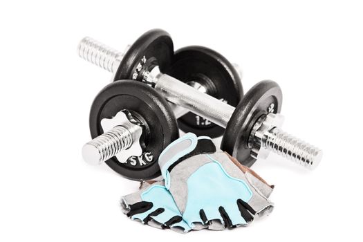 Dumbbells and gym gloves, isolated on a white background.