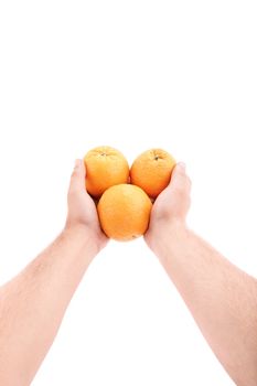 Would you like some oranges? Male hands giving oranges, isolated on white background.