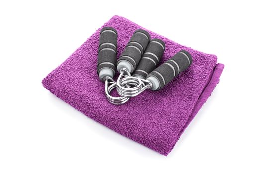 Hand grips on a purple towel, isolated on white background.