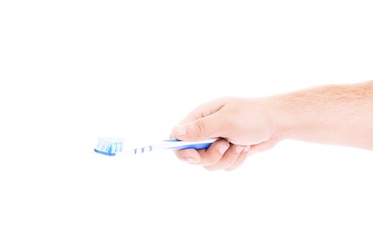 Close-up shot of a male hand holding a toothbrush with paste on it, isolated on white background.