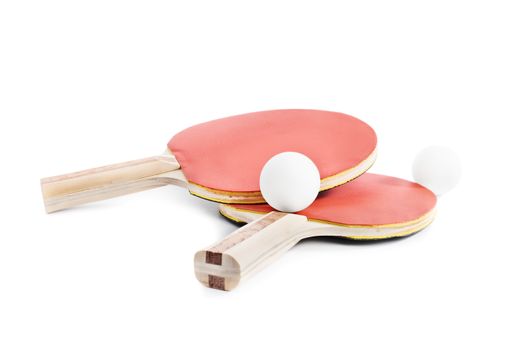 Close up shot of ping-pong bats with two balls, isolated on white background.