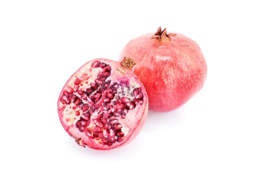 Ripe pomegranates isolated on white background.
