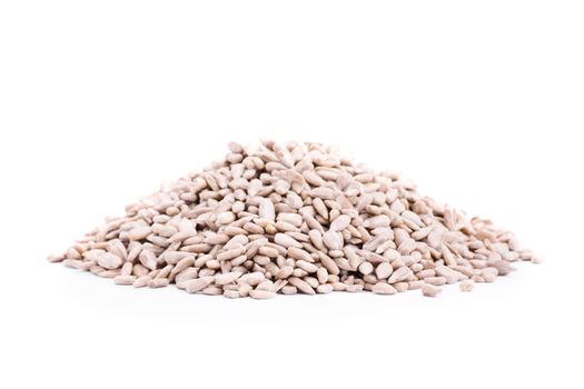 Close up shot of heap of sunflower seeds, isolated on white background.