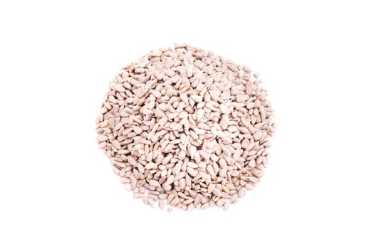 Top perspective on a heap of sunflower seeds, isolated on white background.