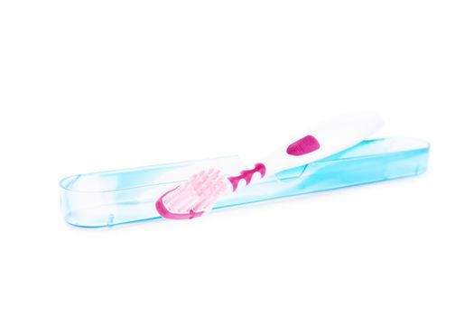 Toothbrush with a travel protective cover, isolated on white background.
