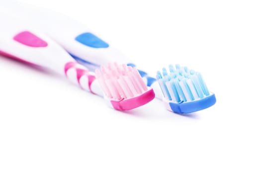 Set of toothbrushes, for him and her, isolated on white background.