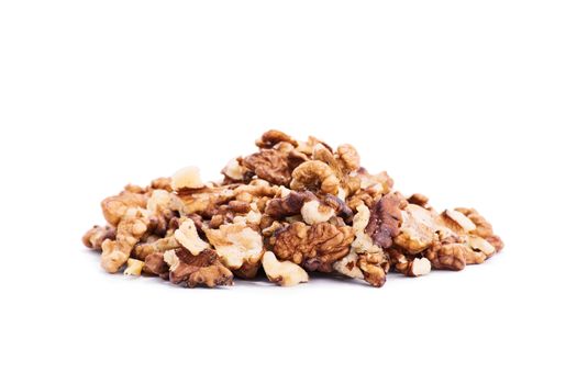 Close up shot of a heap of walnuts, isolated on white background.
