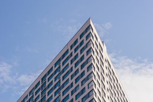 Angle of the Skyscraper on the Cloudy Sky Background. Toned.