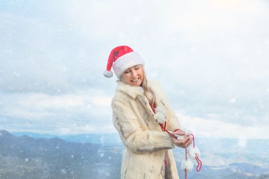 Female in a snowy wintry Blue Mountains scene celebrating Christmas.  Christmas in July, Christmas holiday themes