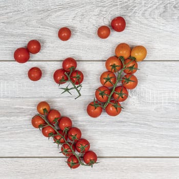 some small tomatoes  on a wooden table