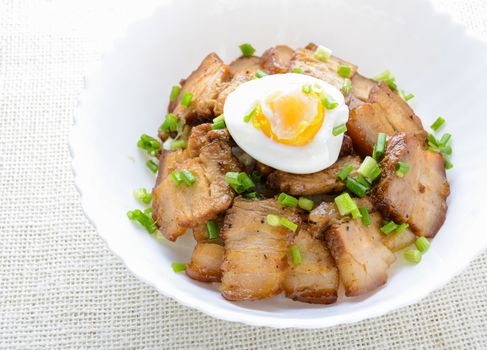 Bowl of rice topped with Braised pork belly and boiled egg, Japanese called Kakuni-don
