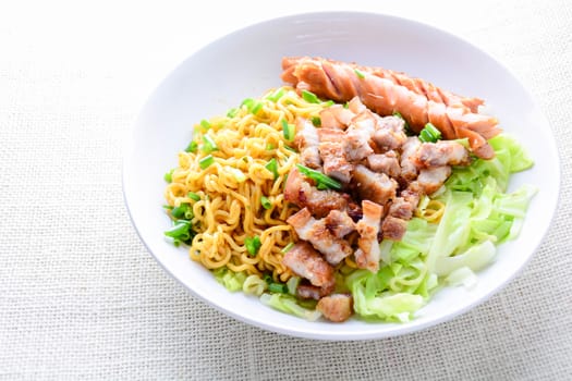 Udon noodles with grilled pork, sausage and cabbage - Japanese cuisine

