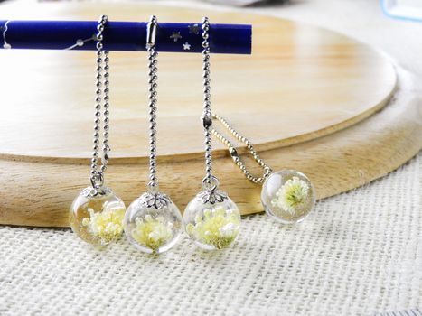 Dried flower in crystal clear resin pendant necklace, pendant with a real flowers. 
