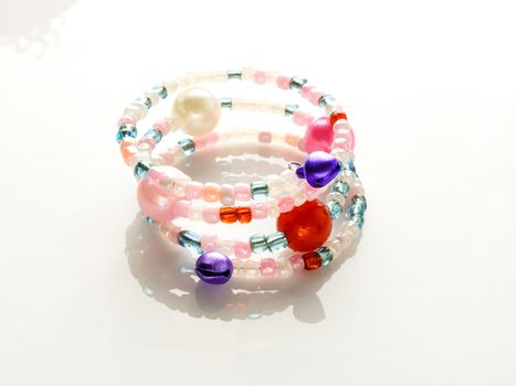 Multi-colored bracelets with beads. Colourful child's bead bracelet.
