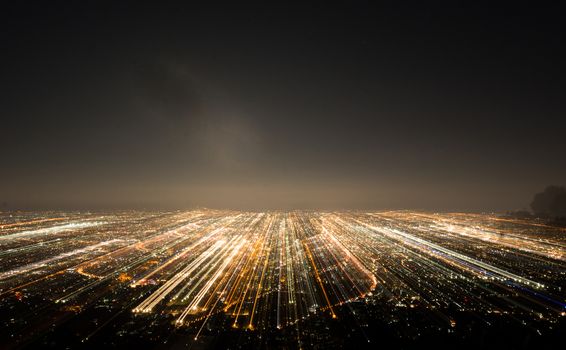 Abstract long exposure, experimental surreal photo, city and vehicle lights at night
