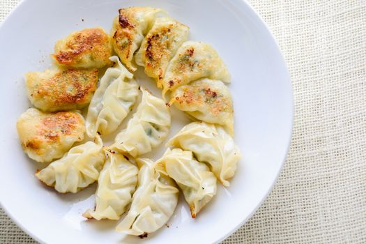 Japanese Fried Dumplings, the half moon-shaped dumplings served in Asian restaurants as an appetiser or side dish, pork and vegetable filling.
