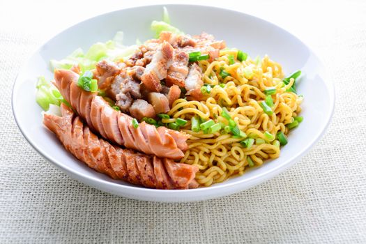 Udon noodles with grilled pork, sausage and cabbage - Japanese cuisine
