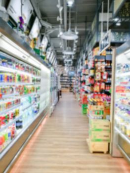 Blurred of product shelves in supermarket or grocery store, use as background
