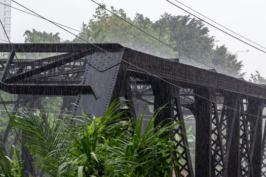 Heavy rainfall hitting steel structure during monsoon season