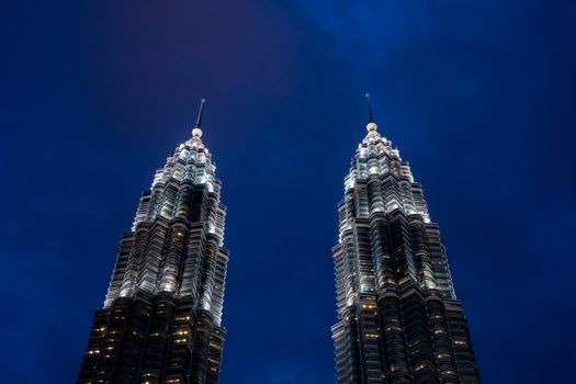 Petronas twin towers spires during dusk in Kuala Lumpur