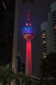 Red illuminated big transmission tower in Kuala Lumpur