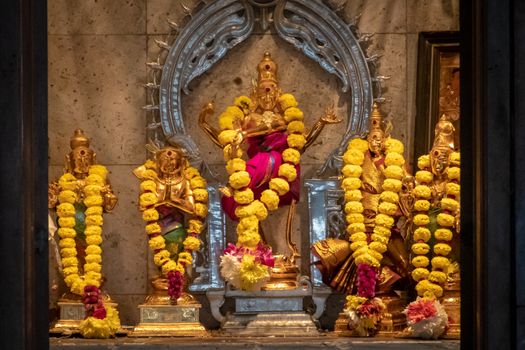 Sri Mahamariamman Temple golden statues in most holy room of Hindu temple