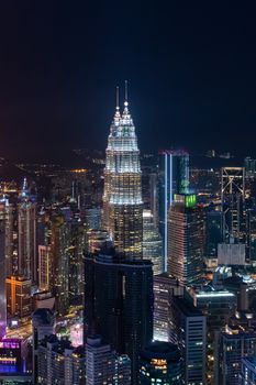 Skyline of Kuala Lumpur during nigh over viewing illuminated highrise building