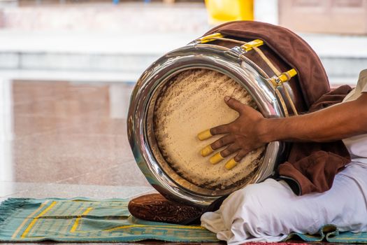 Sri Mahamariamman Temple drum being played during a Puja