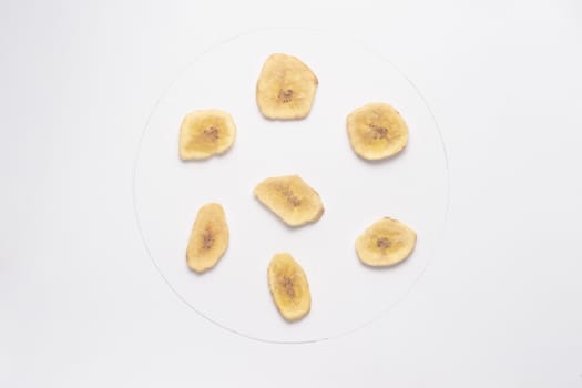 Banana chips isolated on white backgroud. 