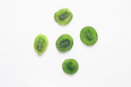 Candied kiwi pieces isolated on white backgroud. 