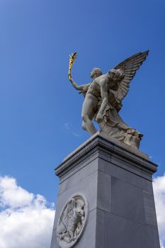 Statue of Greek God Iris carrying fallen hero to Mount Olympus on Schloss Bridge or Schlosbrucke